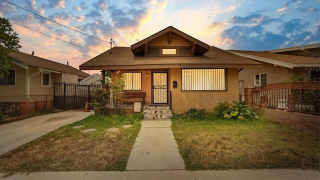 3510 E 2nd St, Los Angeles, CA 90063 - bungalow-style house with stucco siding, covered porch, and a shingled roof