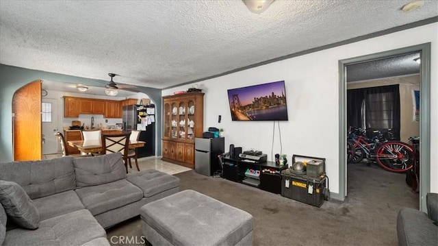 3510 E 2nd St, Los Angeles, CA 90063 - living room with a textured ceiling, light colored carpet, and a ceiling fan