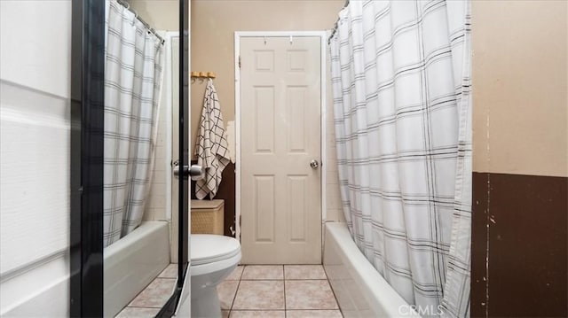 3510 E 2nd St, Los Angeles, CA 90063 - bathroom featuring shower / bath combo with shower curtain, toilet, and tile patterned flooring