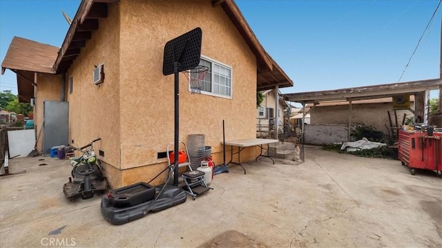 3510 E 2nd St, Los Angeles, CA 90063 - back of house featuring stucco siding, a patio, and a wall mounted AC