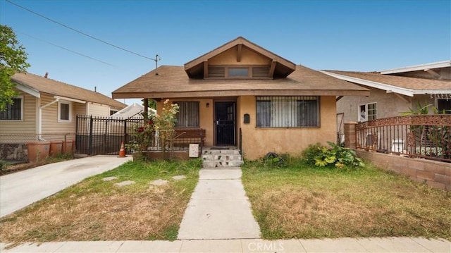 3510 E 2nd St, Los Angeles, CA 90063 - bungalow-style home with stucco siding and covered porch