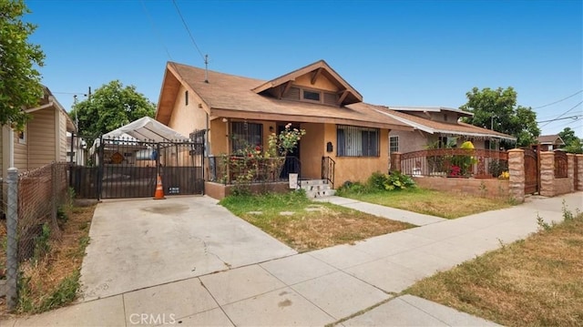 3510 E 2nd St, Los Angeles, CA 90063 - bungalow featuring a gate, stucco siding, and driveway
