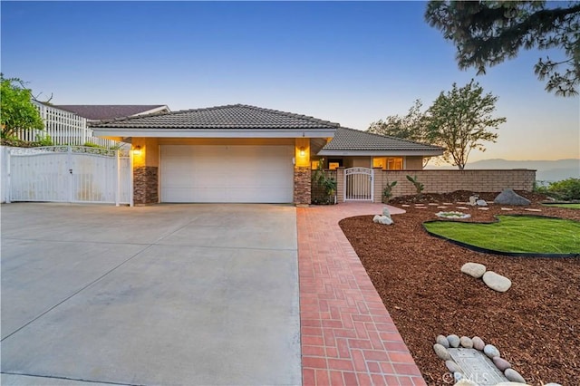 1601 Calle De Armonia, San Dimas, CA 91773 - view of front of house featuring a gate, driveway, a garage, and a tiled roof