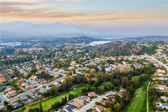 1601 Calle De Armonia, San Dimas, CA 91773 - aerial view of property and surrounding area with a mountain backdrop, nearby suburban area, and a golf course