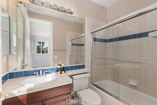 3264 Silver Maple Dr, Yorba Linda, CA 92886 - full bath with vanity, toilet, and bath / shower combo with glass door