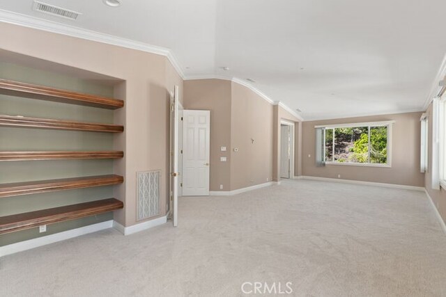 3264 Silver Maple Dr, Yorba Linda, CA 92886 - spare room featuring baseboards, crown molding, carpet floors, and lofted ceiling