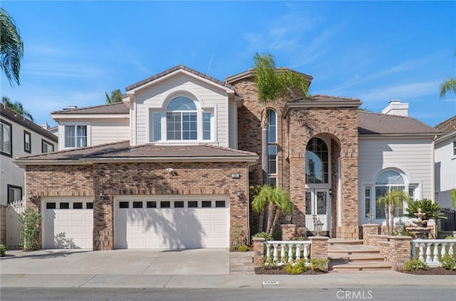 3264 Silver Maple Dr, Yorba Linda, CA 92886 - view of front facade with an attached garage, driveway, and brick siding