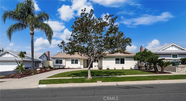 6880 Topaz St, Rancho Cucamonga, CA 91701 - ranch-style home with concrete driveway, a front lawn, and stucco siding