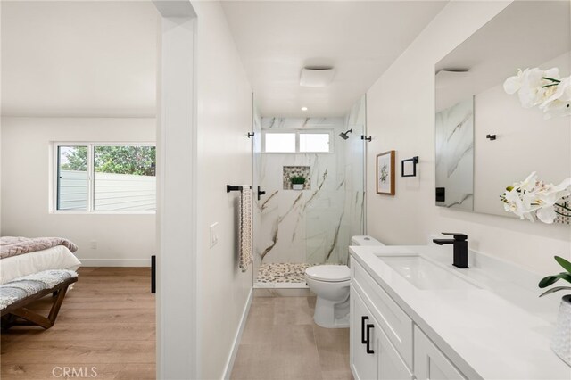 6880 Topaz St, Rancho Cucamonga, CA 91701 - full bath featuring a marble finish shower, vanity, wood finished floors, and plenty of natural light