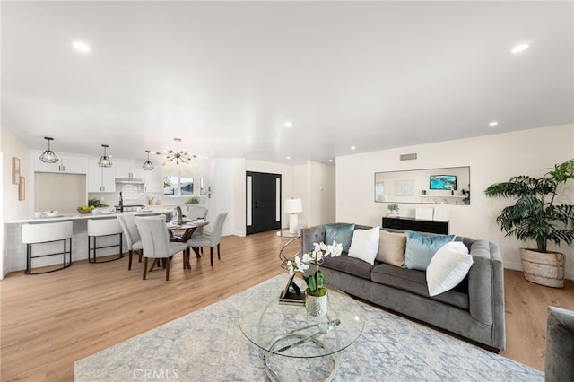 6880 Topaz St, Rancho Cucamonga, CA 91701 - living room with light wood-type flooring and recessed lighting