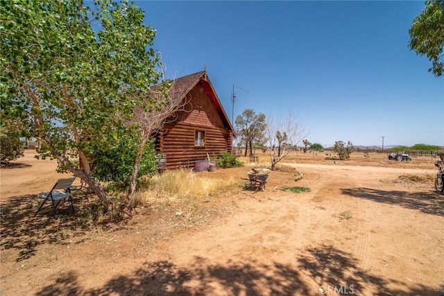 1676 Avalon Ave, Yucca Valley, CA 92284 - view of home's exterior with log exterior