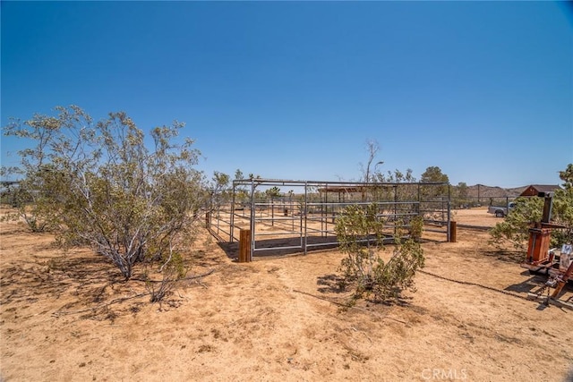 1676 Avalon Ave, Yucca Valley, CA 92284 - view of yard featuring an outbuilding and an exterior structure
