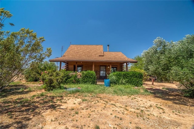 1676 Avalon Ave, Yucca Valley, CA 92284 - rear view of house with covered porch and log exterior