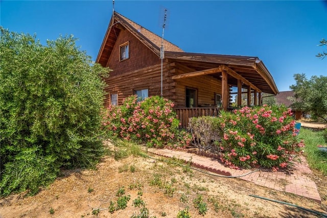 1676 Avalon Ave, Yucca Valley, CA 92284 - view of property exterior featuring log siding