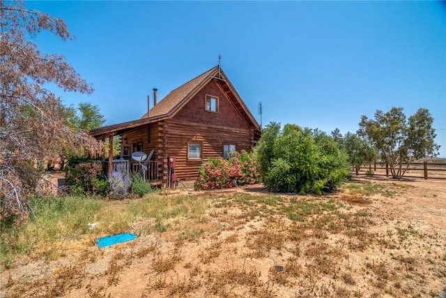 1676 Avalon Ave, Yucca Valley, CA 92284 - back of property featuring log exterior