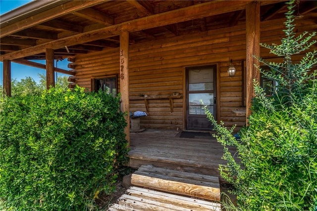 1676 Avalon Ave, Yucca Valley, CA 92284 - view of exterior entry with log siding