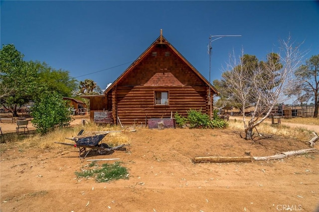 1676 Avalon Ave, Yucca Valley, CA 92284 - view of side of property featuring log exterior