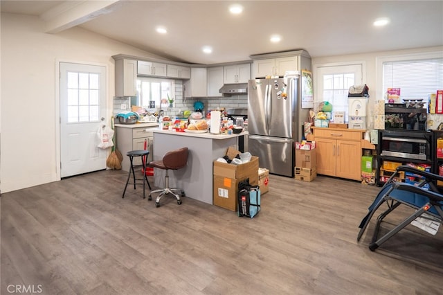 13672 Monroe St, Westminster, CA 92683 - kitchen featuring appliances with stainless steel finishes, backsplash, light countertops, light wood-style flooring, and recessed lighting