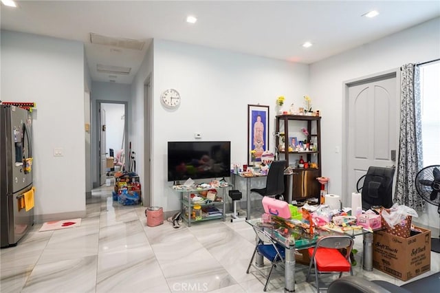13672 Monroe St, Westminster, CA 92683 - living area with a desk, recessed lighting, and light marble finish flooring
