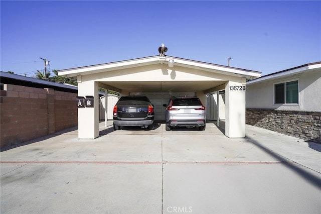 13672 Monroe St, Westminster, CA 92683 - view of vehicle parking featuring a carport and concrete driveway