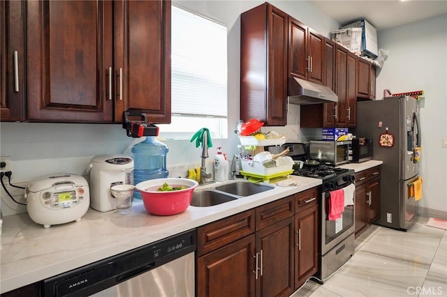 13672 Monroe St, Westminster, CA 92683 - kitchen with under cabinet range hood, stainless steel appliances, light countertops, and a sink