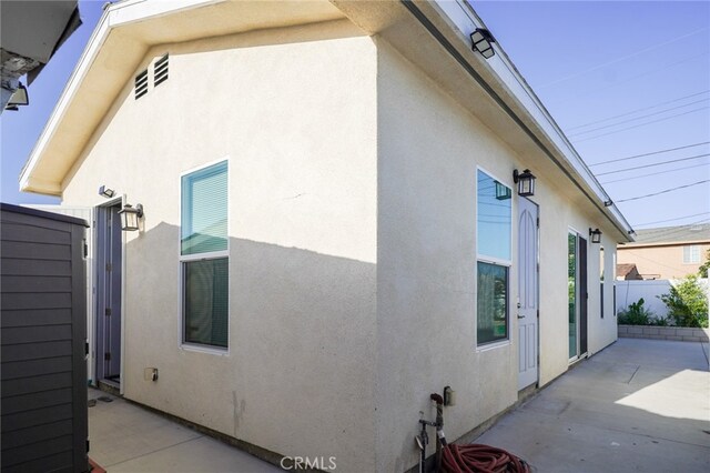 13672 Monroe St, Westminster, CA 92683 - view of property exterior with stucco siding and a patio area