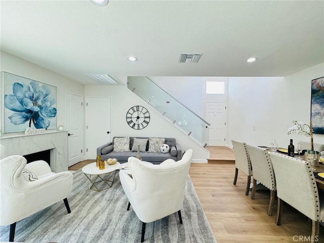 32942 Paseo Del Lucero, San Juan Capistrano, CA 92675 - living room with stairway, light wood-type flooring, and recessed lighting