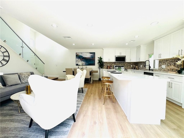 32942 Paseo Del Lucero, San Juan Capistrano, CA 92675 - living area with light wood finished floors, recessed lighting, and stairway