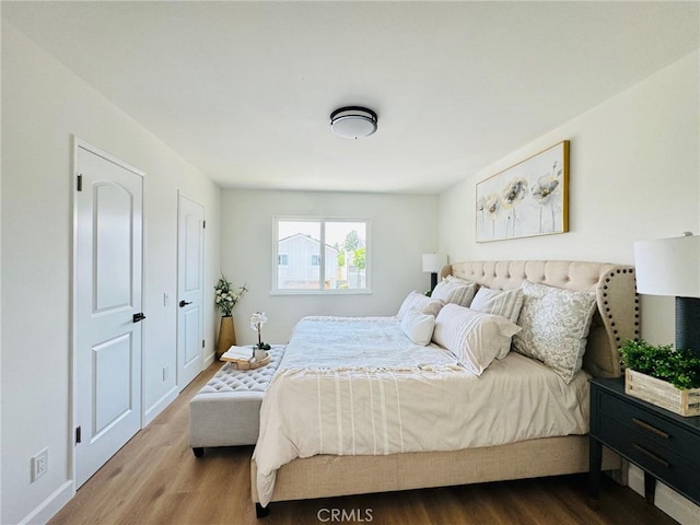 32942 Paseo Del Lucero, San Juan Capistrano, CA 92675 - bedroom with wood finished floors and baseboards