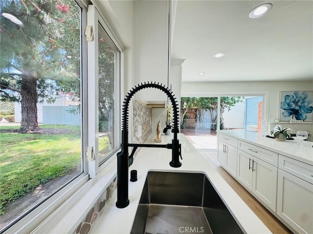 32942 Paseo Del Lucero, San Juan Capistrano, CA 92675 - kitchen view of white cabinets, recessed lighting, and light countertops