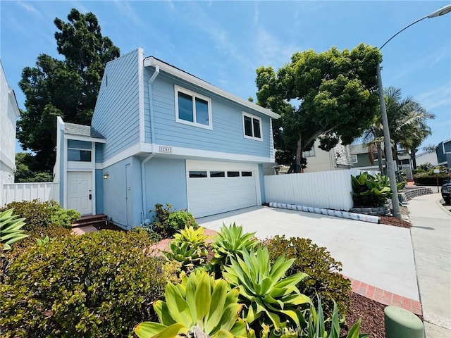 32942 Paseo Del Lucero, San Juan Capistrano, CA 92675 - view of side of property featuring a garage, concrete driveway, and stucco siding