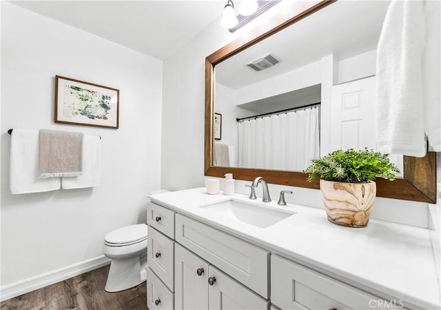 564 N Bellflower Blvd Unit 120, Long Beach, CA 90814 - full bath featuring vanity, wood finished floors, toilet, and baseboards