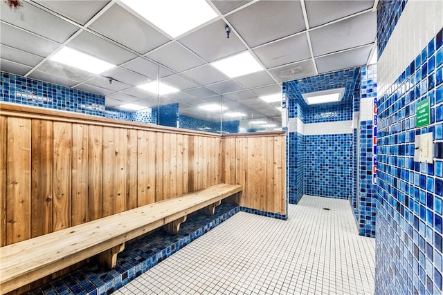 564 N Bellflower Blvd Unit 120, Long Beach, CA 90814 - misc room with wood walls, tile patterned flooring, and a drop ceiling