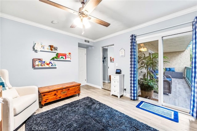 564 N Bellflower Blvd Unit 120, Long Beach, CA 90814 - sitting room featuring wood finished floors, crown molding, baseboards, and ceiling fan