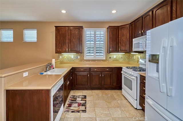 1558 Rockrose Way, Beaumont, CA 92223 - kitchen with white appliances, a sink, tasteful backsplash, light countertops, and recessed lighting