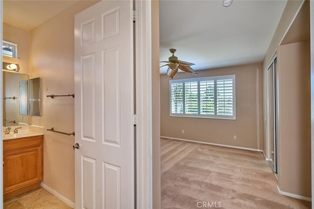 1558 Rockrose Way, Beaumont, CA 92223 - bathroom featuring a ceiling fan, vanity, and baseboards