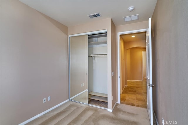 1558 Rockrose Way, Beaumont, CA 92223 - unfurnished bedroom featuring arched walkways, carpet floors, a closet, baseboards, and recessed lighting