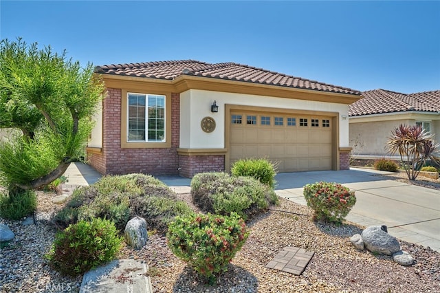 1558 Rockrose Way, Beaumont, CA 92223 - mediterranean / spanish house featuring brick siding, a garage, driveway, stucco siding, and a tiled roof