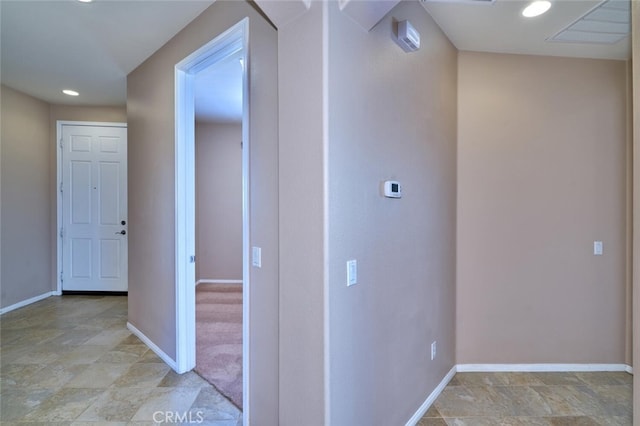 1558 Rockrose Way, Beaumont, CA 92223 - corridor featuring baseboards, light stone finish floors, and recessed lighting
