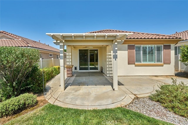 1558 Rockrose Way, Beaumont, CA 92223 - rear view of house with ceiling fan, stucco siding, a tiled roof, and a patio