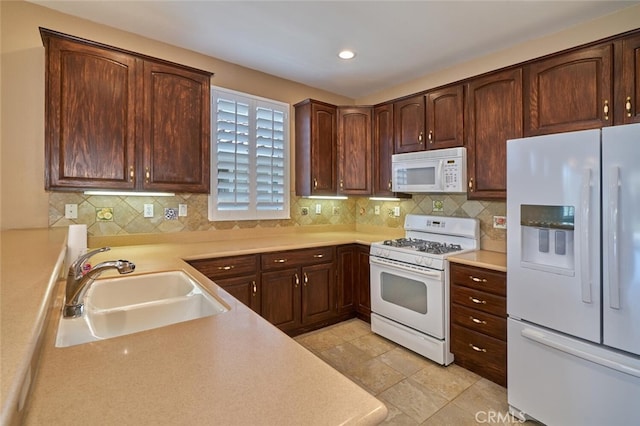 1558 Rockrose Way, Beaumont, CA 92223 - kitchen with white appliances, a sink, light countertops, decorative backsplash, and recessed lighting