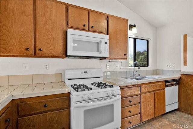 10824 Sundance Dr, Rancho Cucamonga, CA 91730 - kitchen with white appliances, a sink, lofted ceiling, brown cabinets, and tile countertops