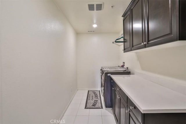 6886 Cache Way, Jurupa Valley, CA 91752 - laundry area with cabinet space, light tile patterned floors, and washer and dryer