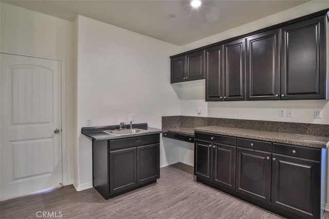 6886 Cache Way, Jurupa Valley, CA 91752 - kitchen featuring wood finished floors and dark countertops