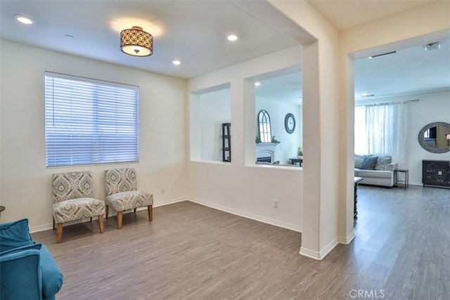 6886 Cache Way, Jurupa Valley, CA 91752 - sitting room with wood finished floors and recessed lighting