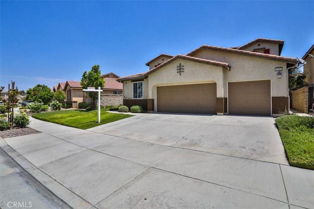 6886 Cache Way, Jurupa Valley, CA 91752 - mediterranean / spanish-style home with an attached garage, stucco siding, driveway, a front lawn, and a tiled roof