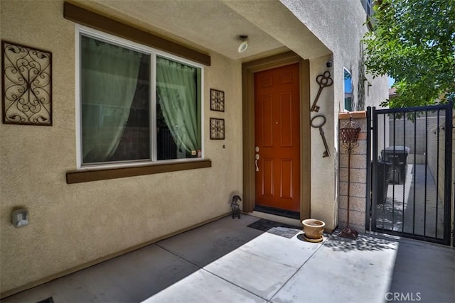 6886 Cache Way, Jurupa Valley, CA 91752 - view of exterior entry with stucco siding and a gate