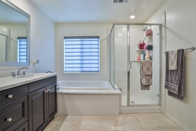 6886 Cache Way, Jurupa Valley, CA 91752 - full bathroom featuring vanity, a garden tub, and a shower stall