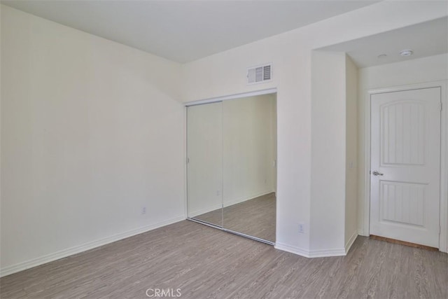 6886 Cache Way, Jurupa Valley, CA 91752 - unfurnished bedroom featuring wood finished floors and a closet