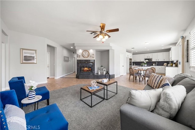 12337 Columbia Ln, Eastvale, CA 91752 - living area with light tile patterned flooring, ceiling fan, recessed lighting, and a fireplace